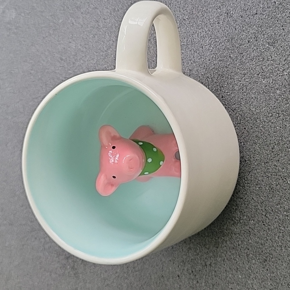 Pig inside coffee mug